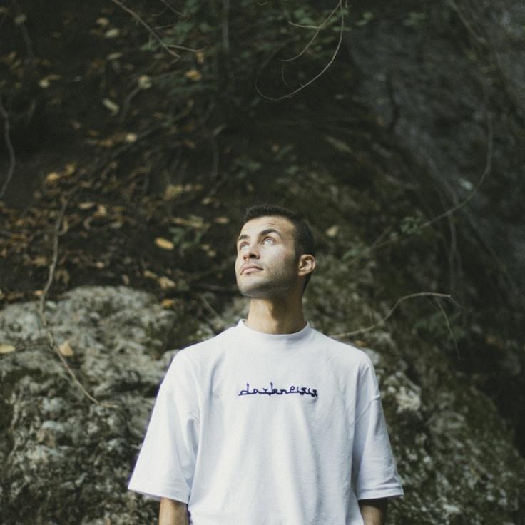 Kaveri Mehta, Lead Design Curator at Glass Brook Studio, reviewing corporate floral arrangements